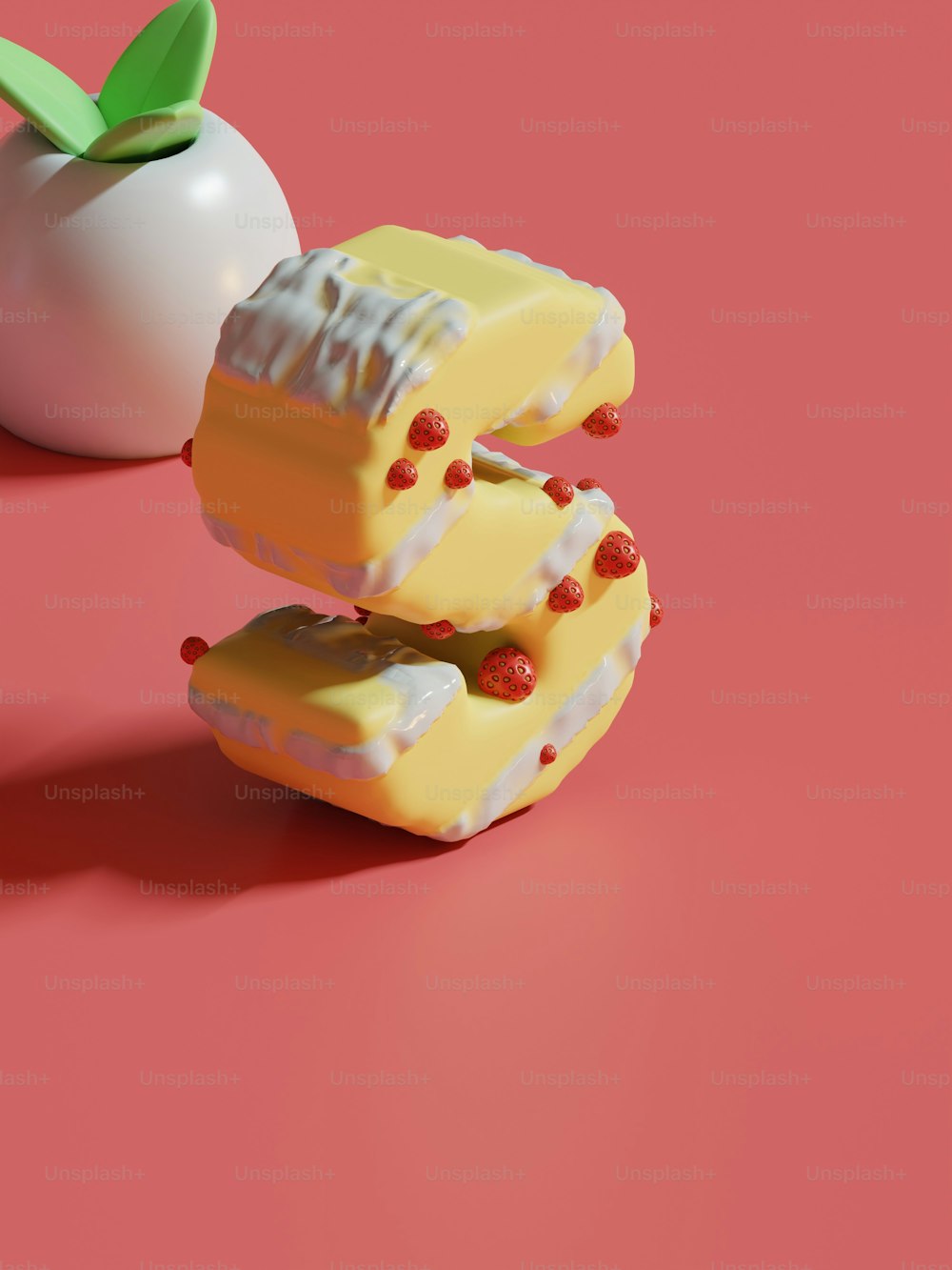 a piece of cake next to an apple on a pink surface