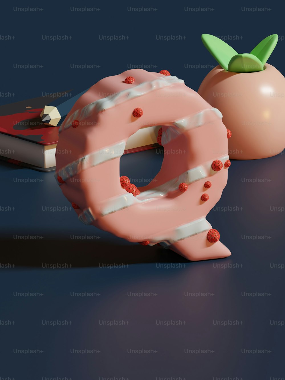 um donut com uma cereja em cima dele ao lado de um livro