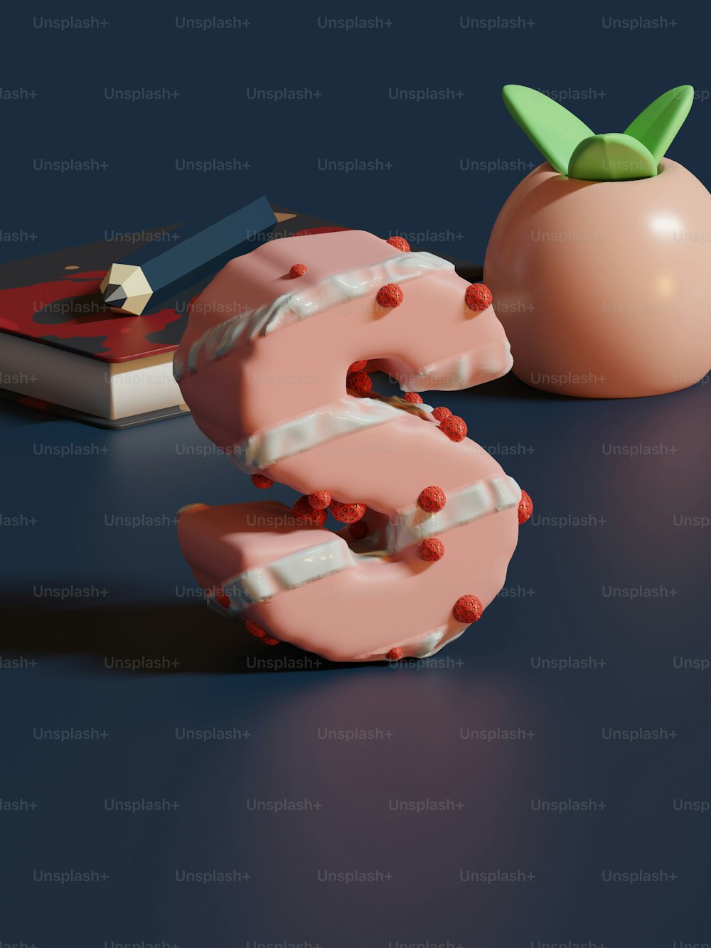 a donut that is next to a book and an apple