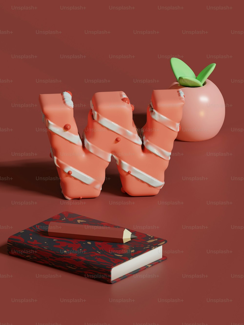 Un libro, una matita e una mela su una superficie rossa