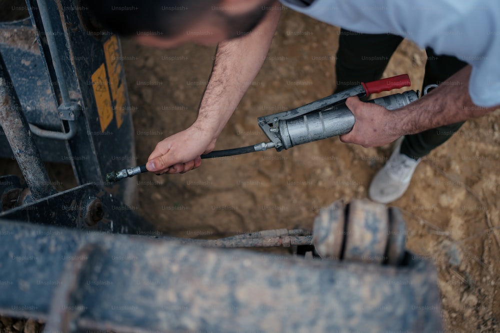 a man working on a piece of machinery