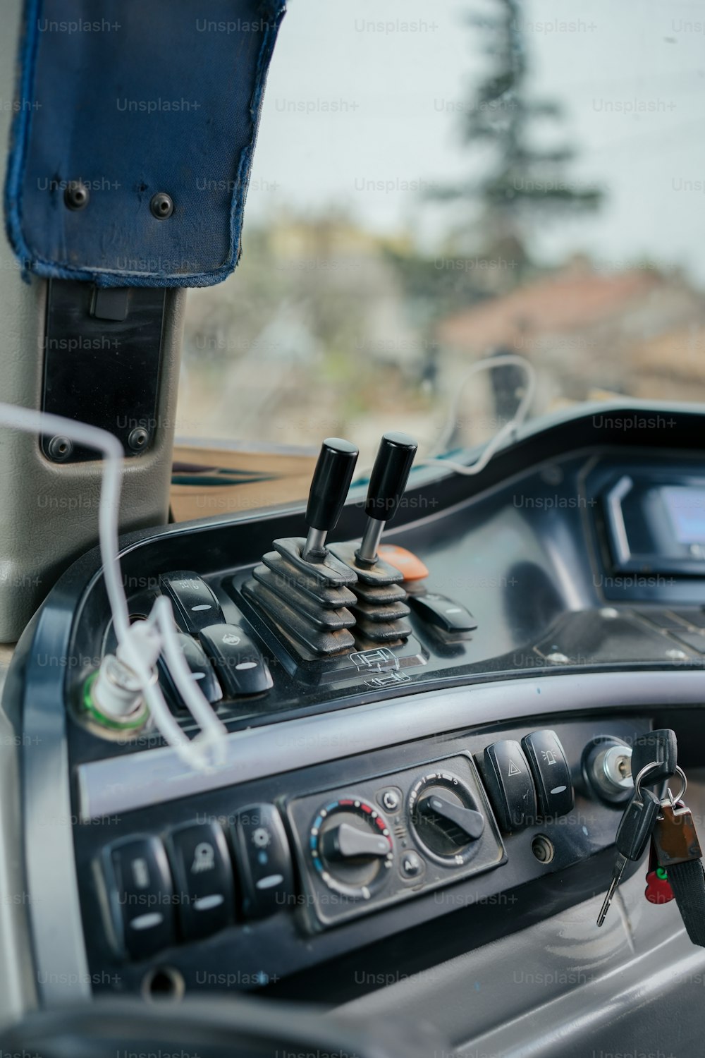 a dashboard of a vehicle with a steering wheel
