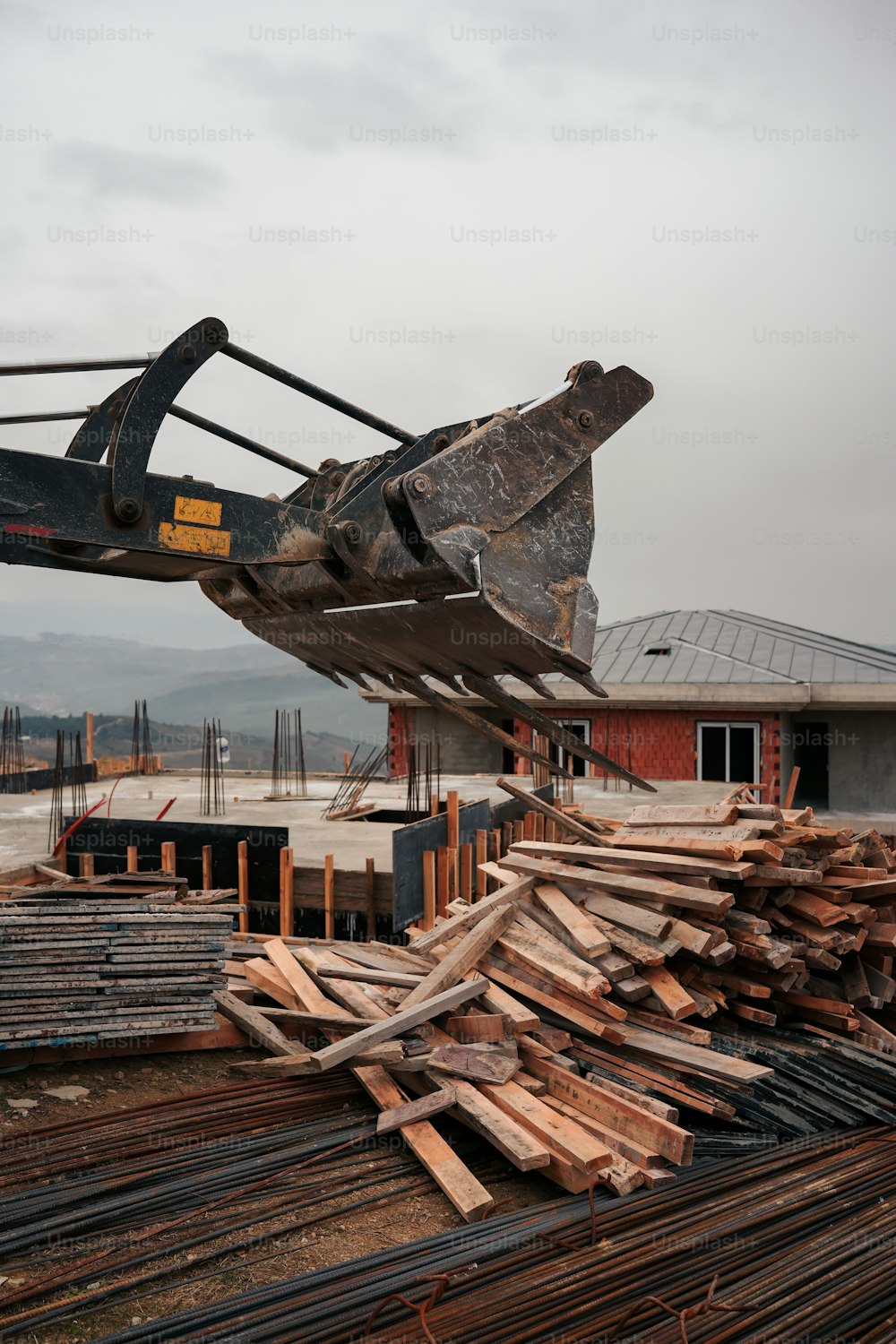 a pile of wood sitting next to a building