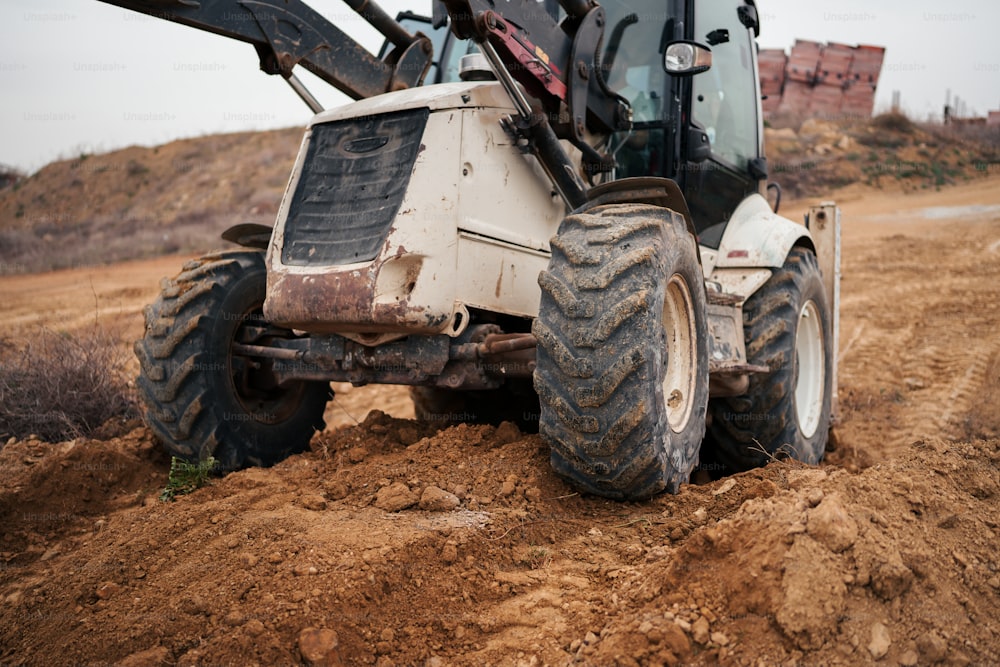 a tractor that is sitting in the dirt