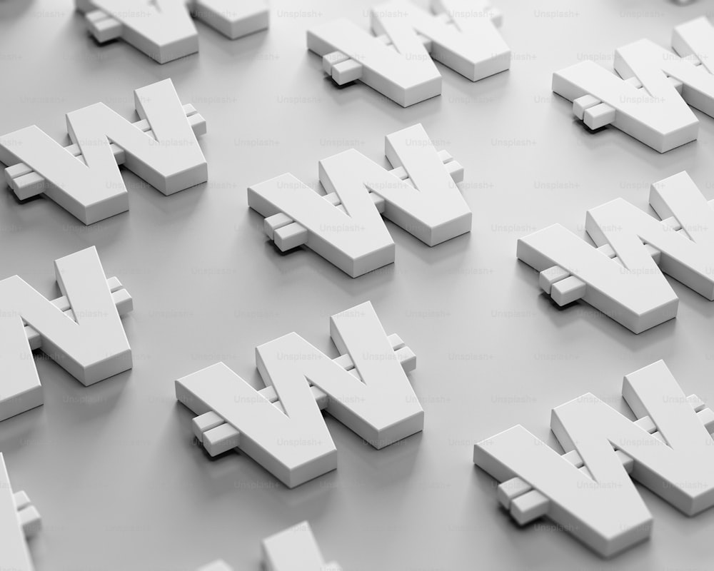 a large group of white letters on a gray surface