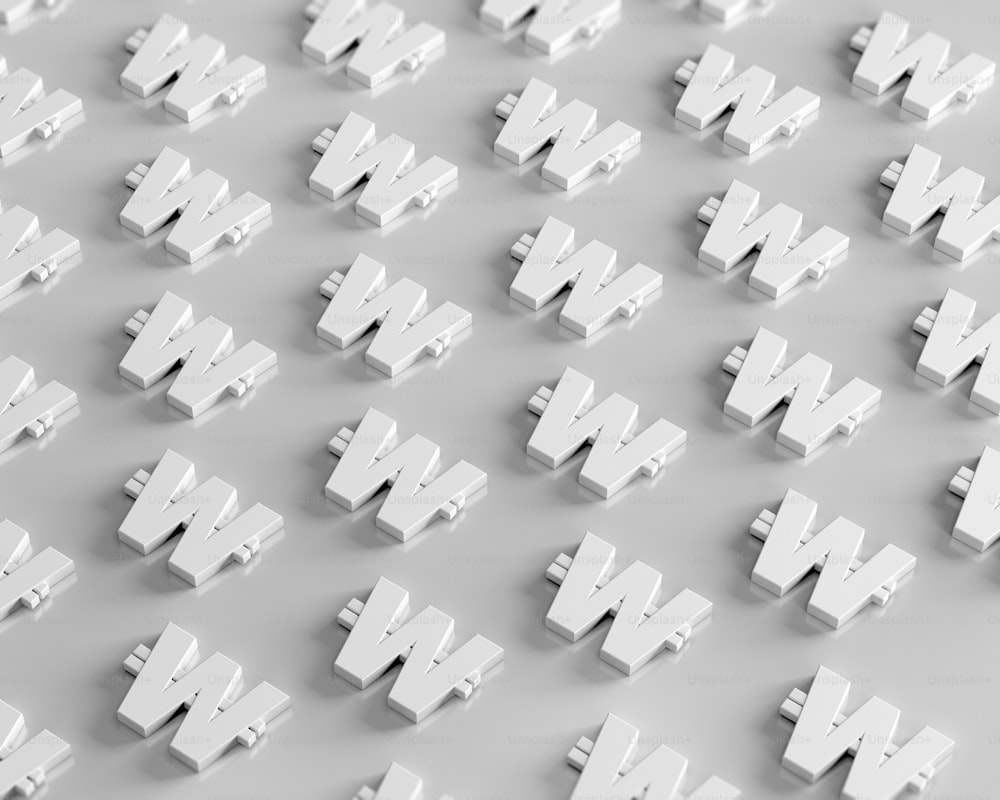 a large group of white letters on a gray surface