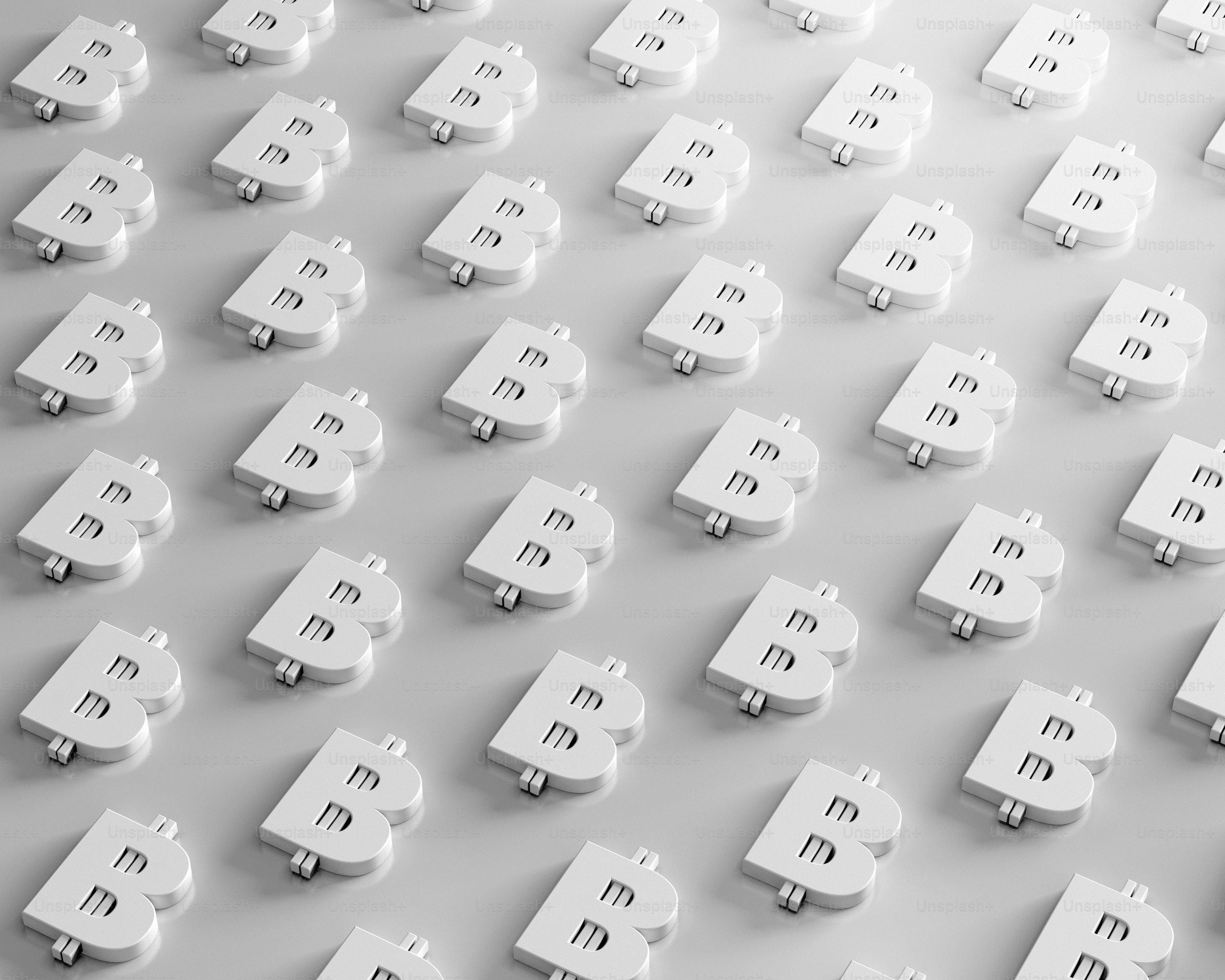 a large group of white bitcoins sitting on top of each other