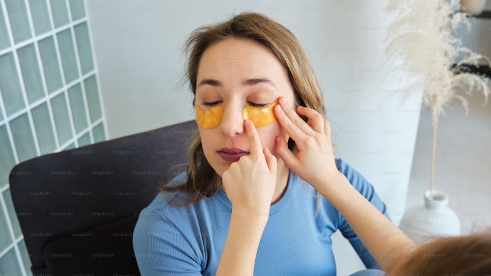 a woman holding a piece of fruit in front of her face