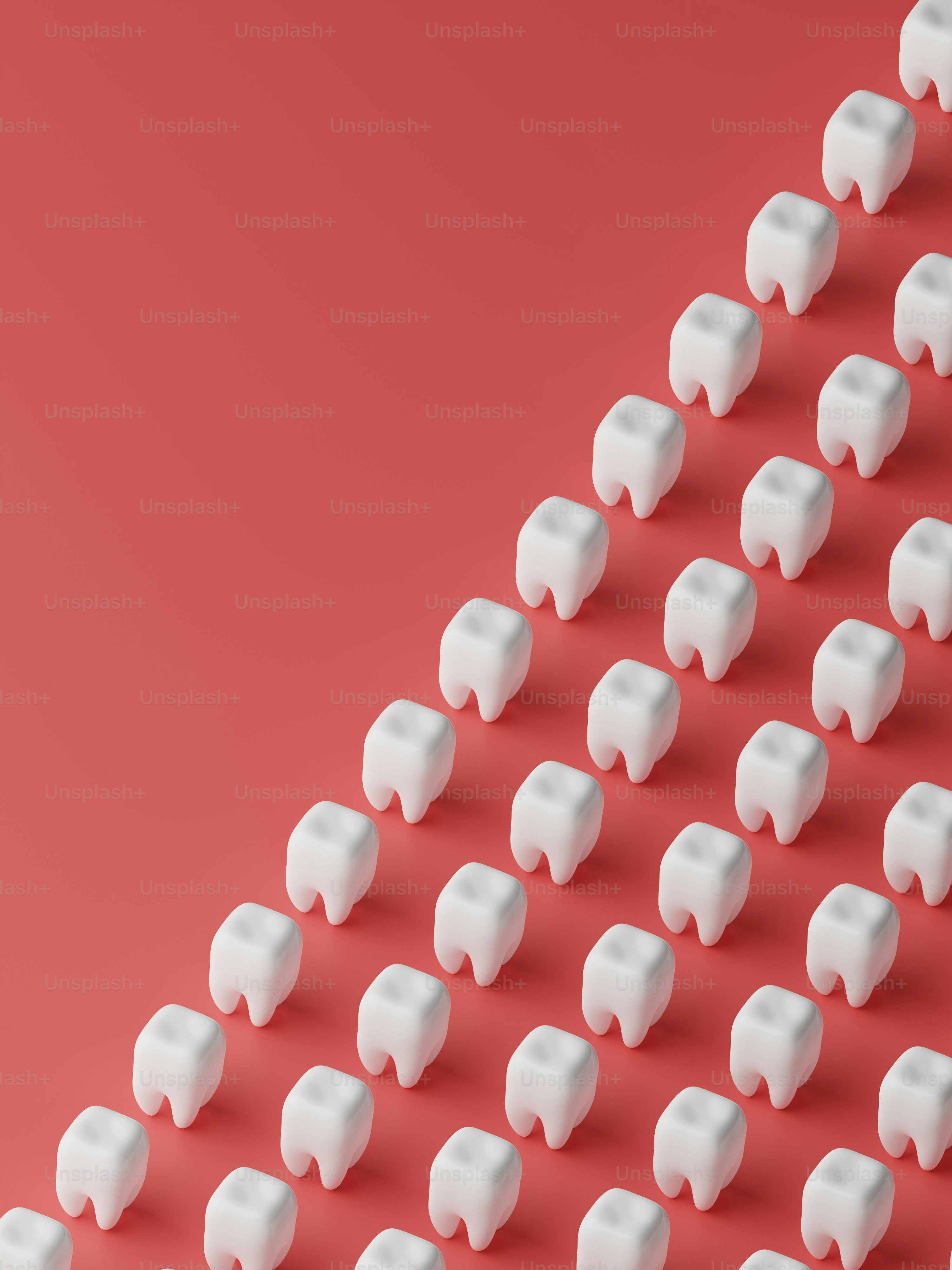 Un grande gruppo di oggetti bianchi su sfondo rosso