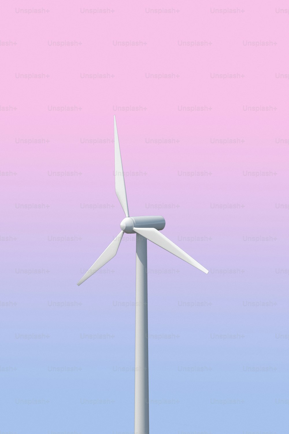 Una turbina eolica con un cielo rosa sullo sfondo