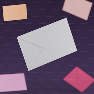 a group of different colored envelopes flying through the air