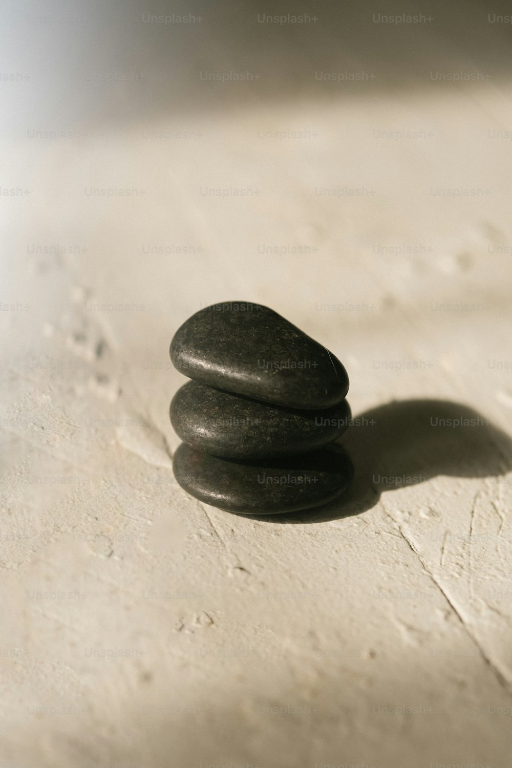 a stack of rocks sitting on top of a white counter