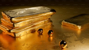 Una pila de lingotes de oro sentados encima de una mesa