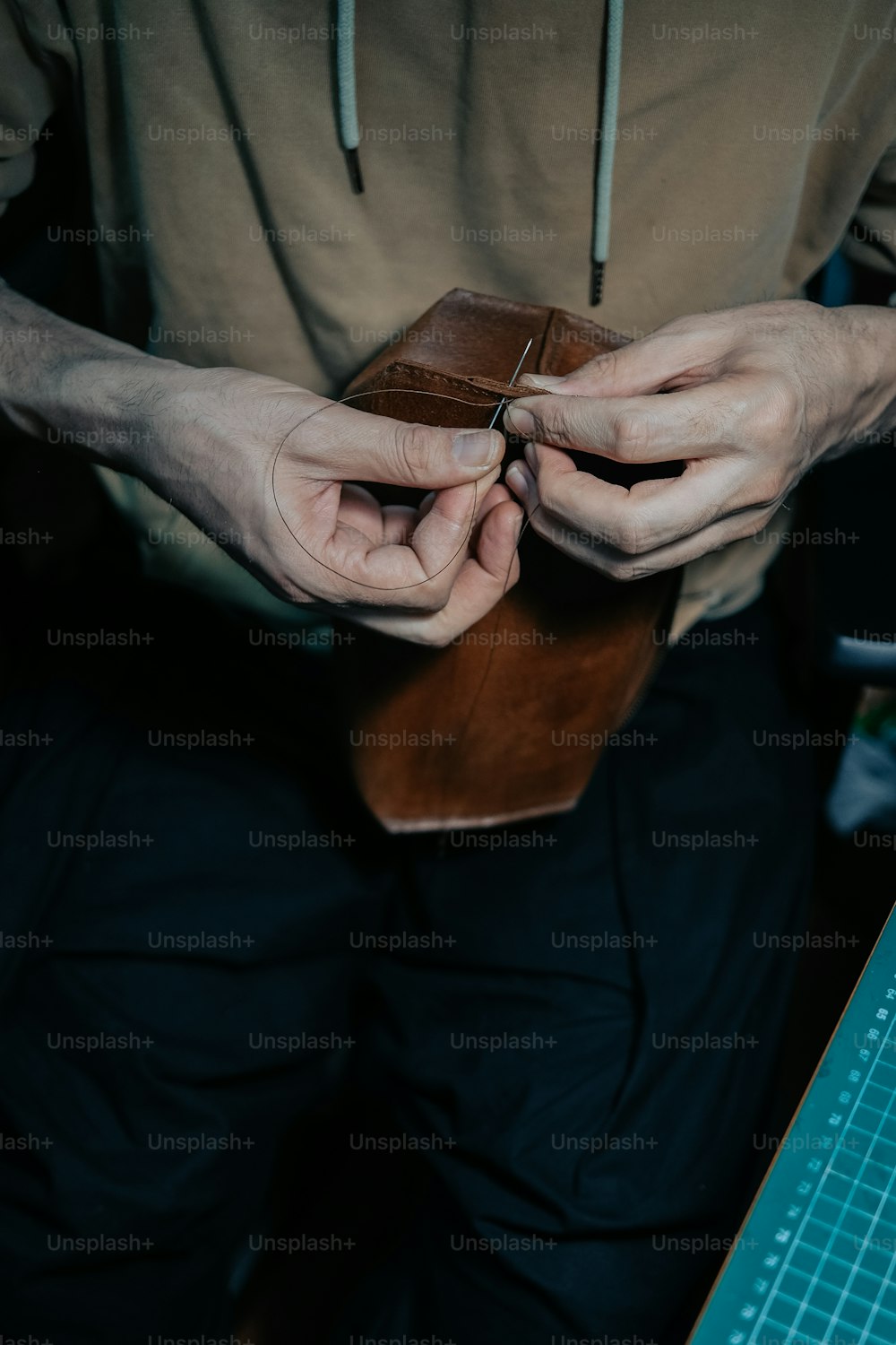 a person holding a piece of wood in their hands