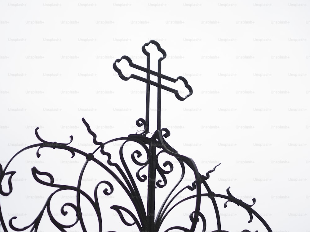 a cross on top of a metal structure