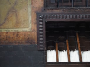 a bunch of white tooth brushes in a window