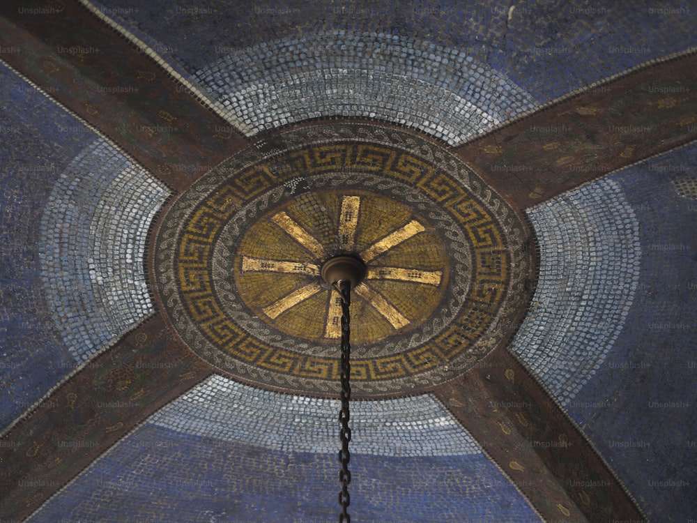 the ceiling of a building with a clock on it