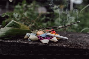 a bunch of incense sticks sitting on top of a wooden table