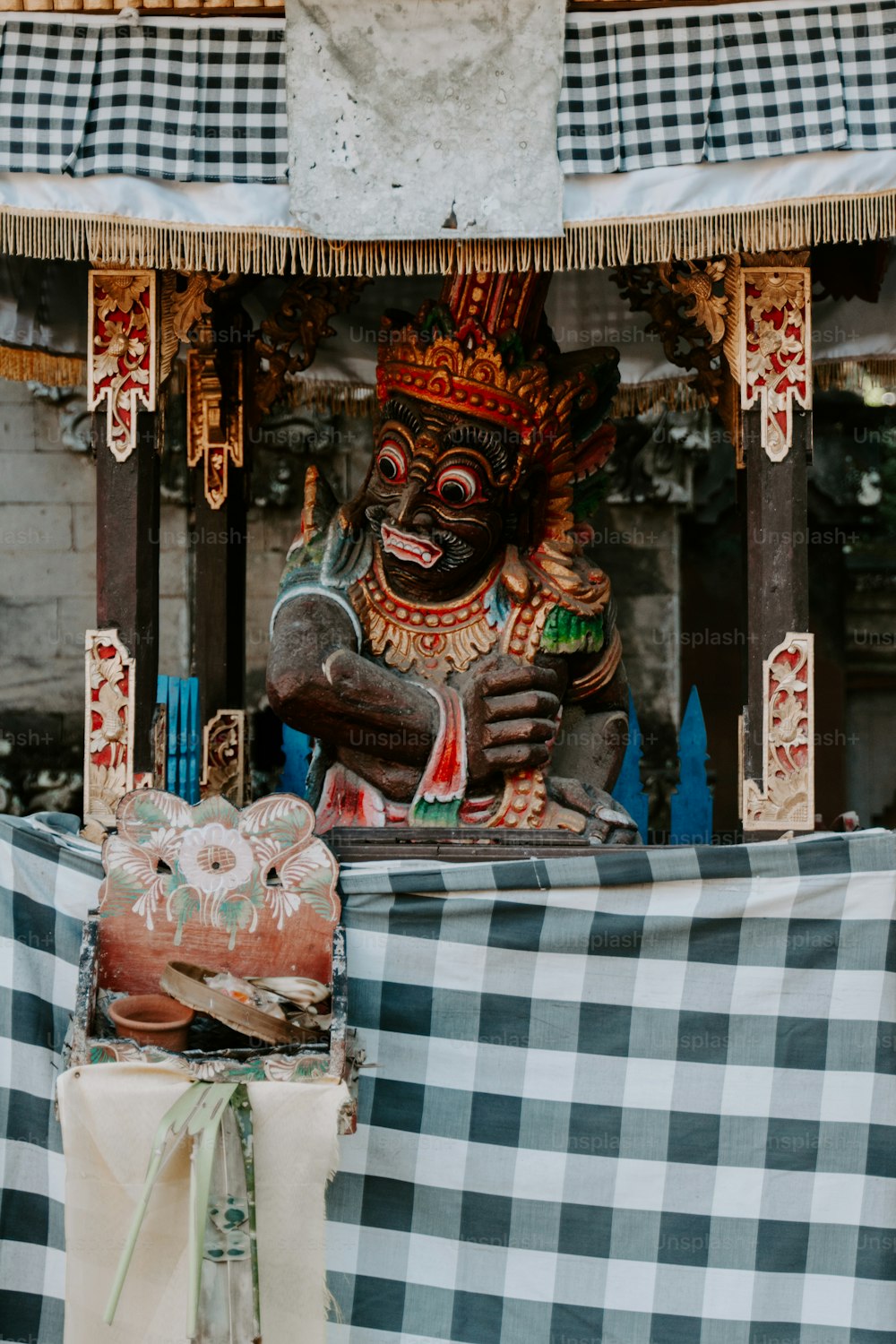 a statue of a person sitting on a bench