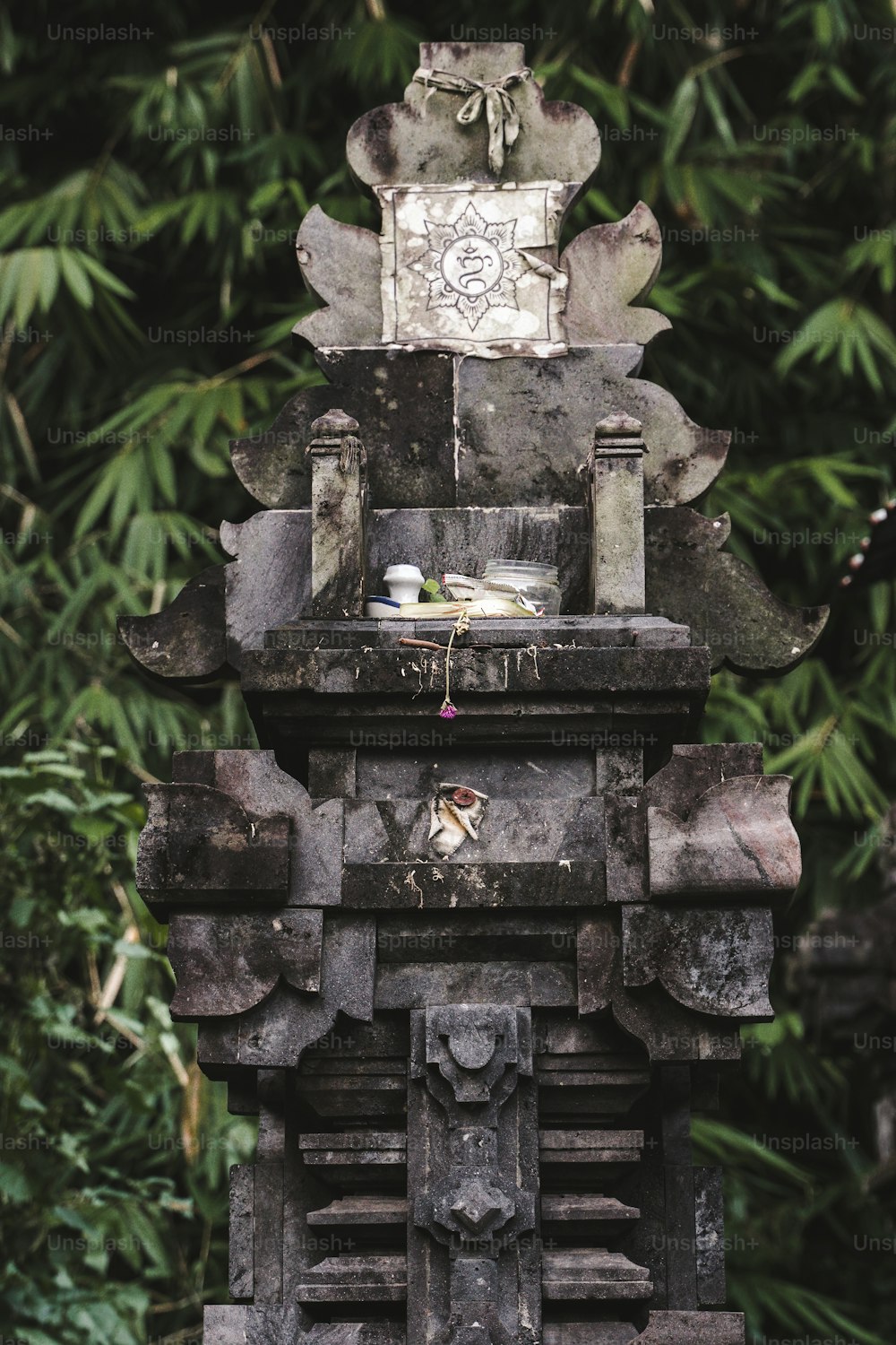 a statue of a person sitting on top of a bench