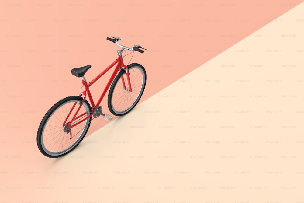 Una bicicleta roja está de pie sobre un fondo rosa y beige