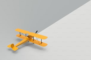 a small yellow airplane is flying in the air