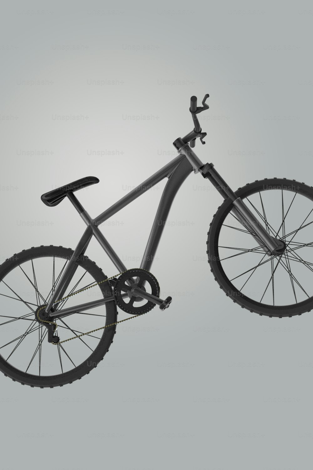 ein Fahrrad, das auf grauem Hintergrund in der Luft liegt