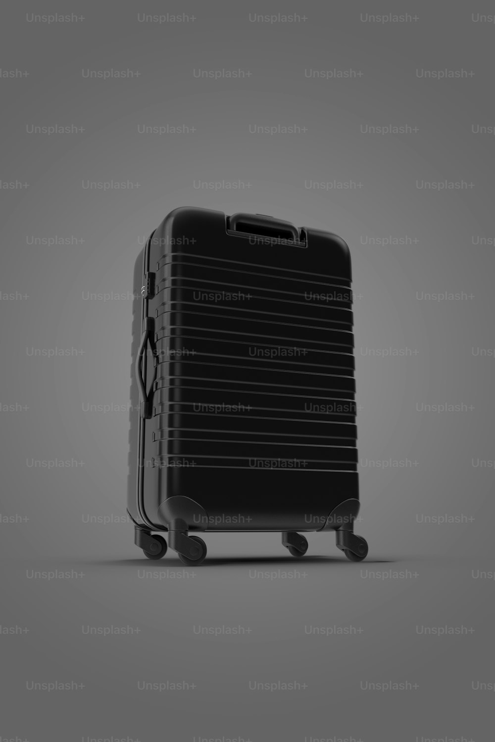 Una pieza de equipaje negra sobre un fondo gris