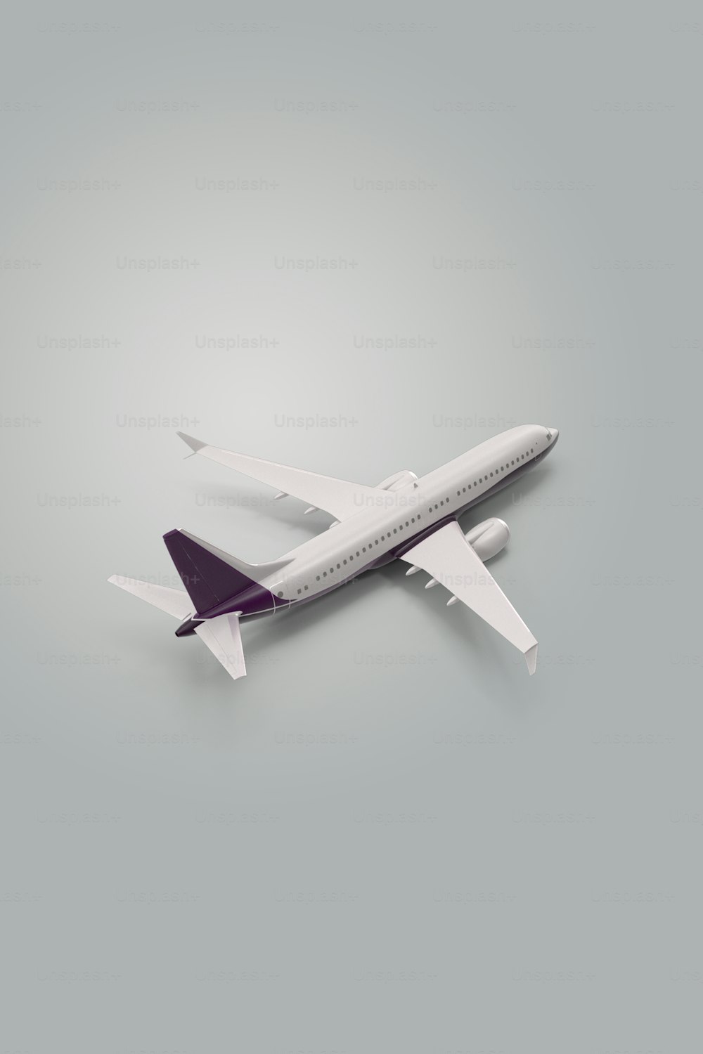 Ein Modell eines Flugzeugs auf grauem Hintergrund