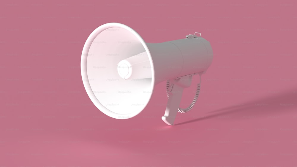 a white bullhorn on a pink background