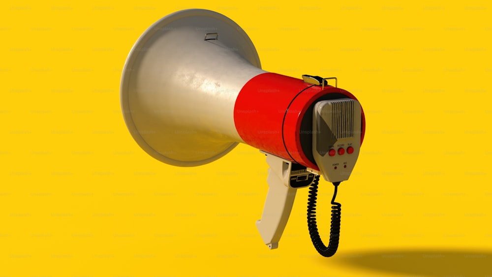 un mégaphone rouge et blanc sur fond jaune