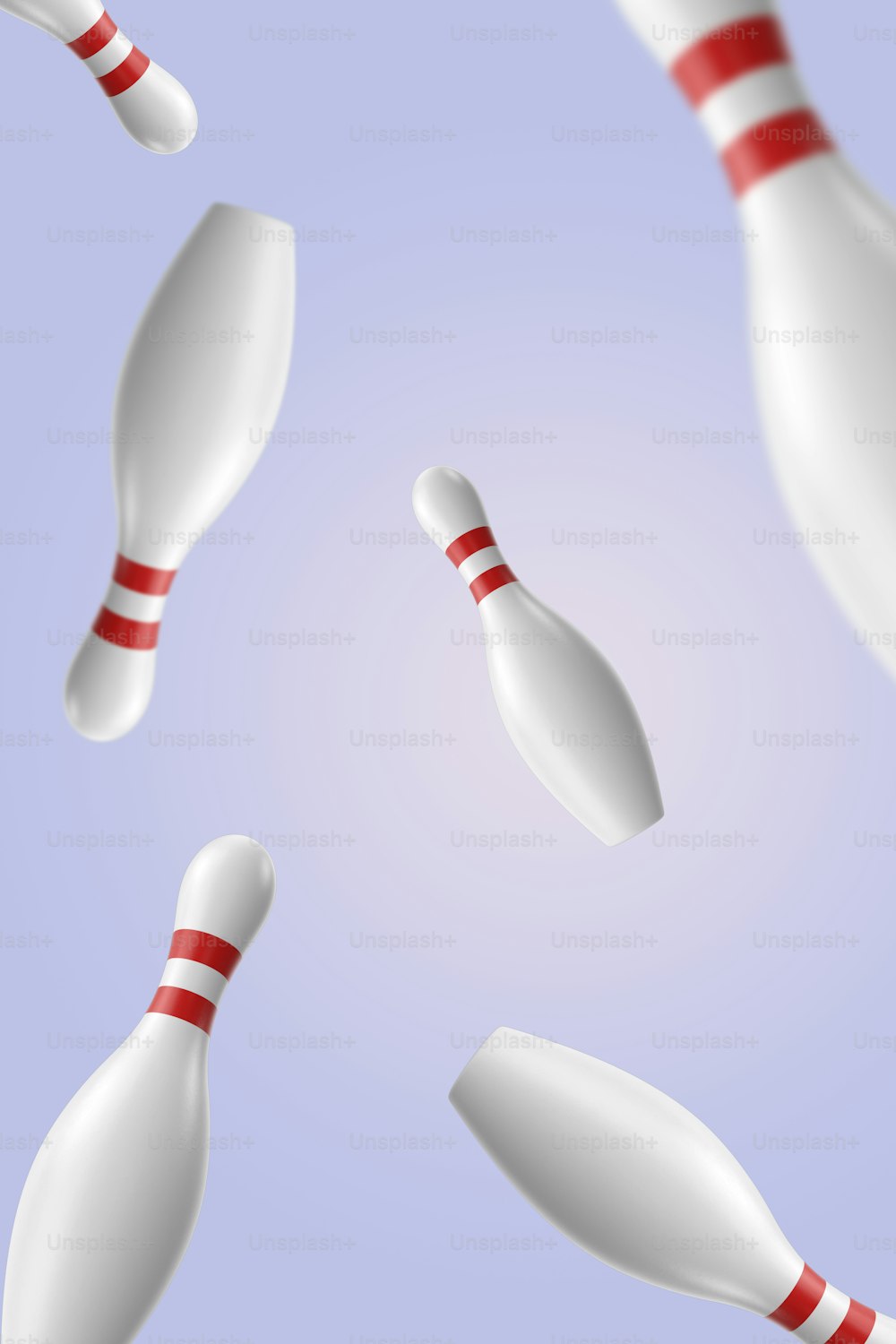 un groupe de quilles de bowling blanches volant dans les airs