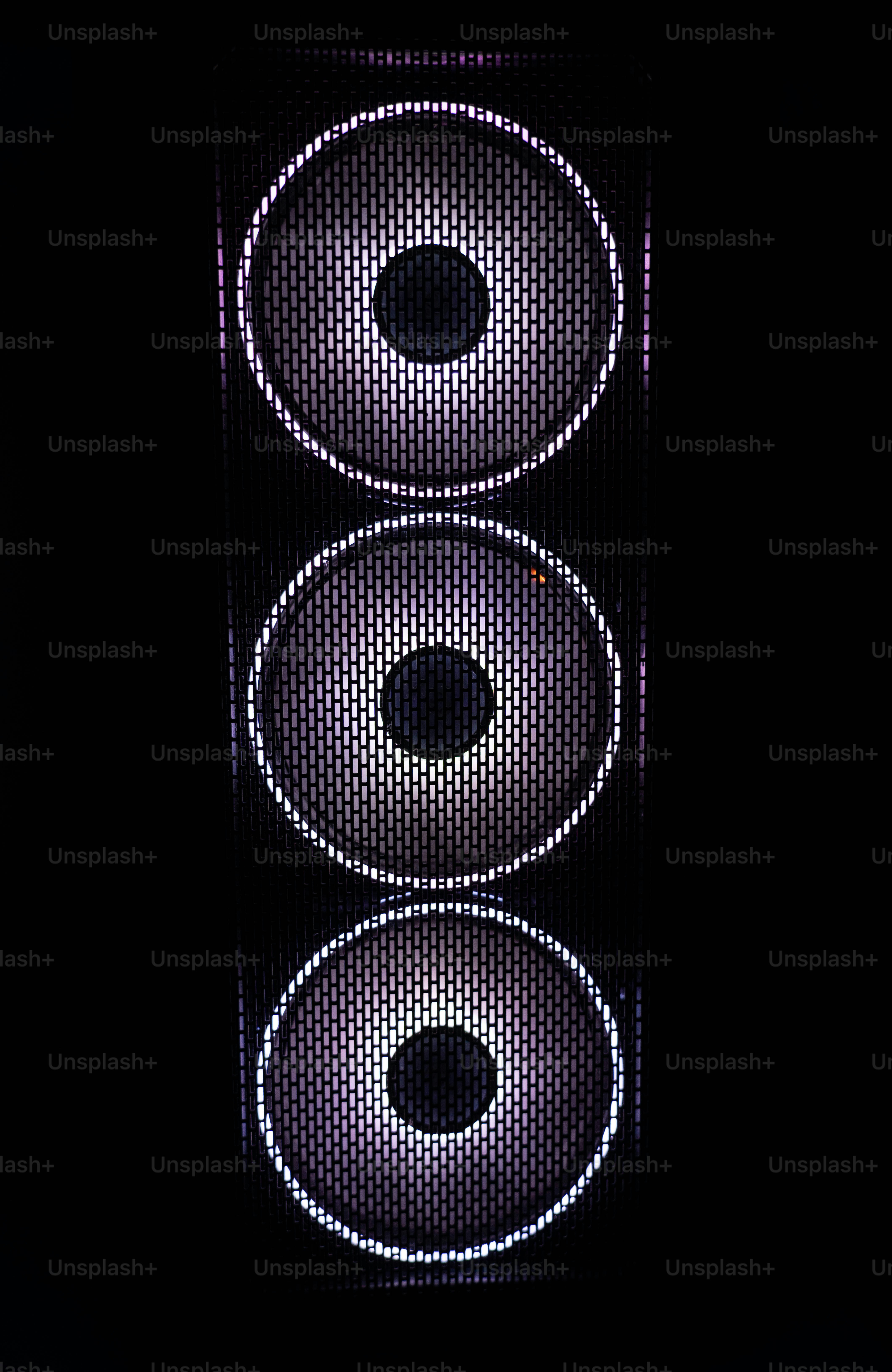 a close up of a traffic light in the dark