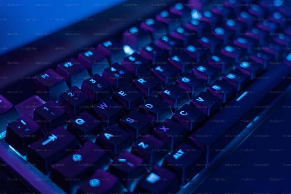 a close up of a keyboard with a blue background