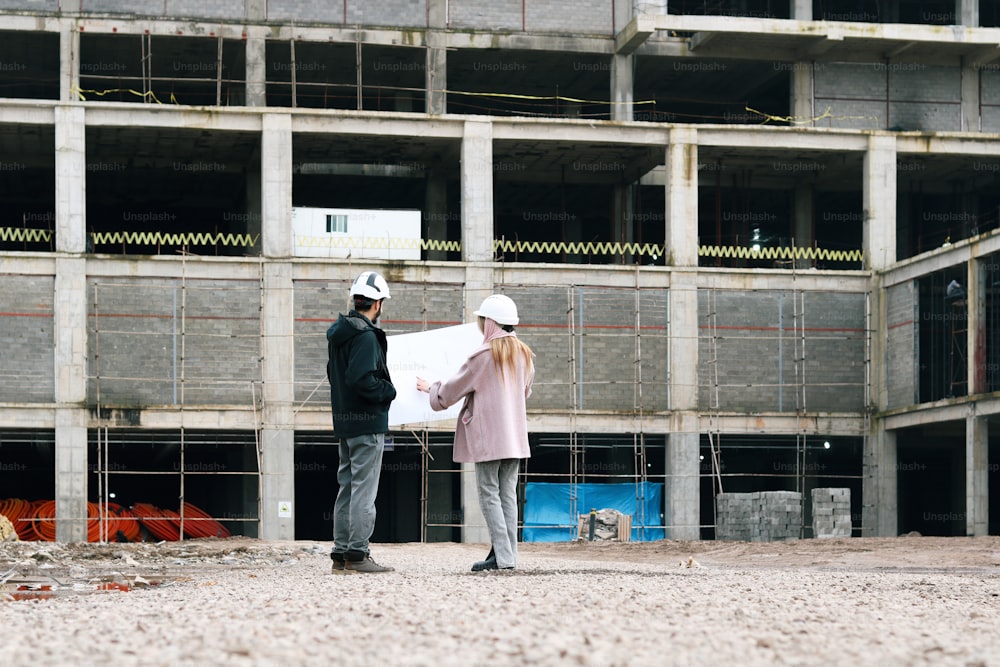 a couple of people standing in front of a building