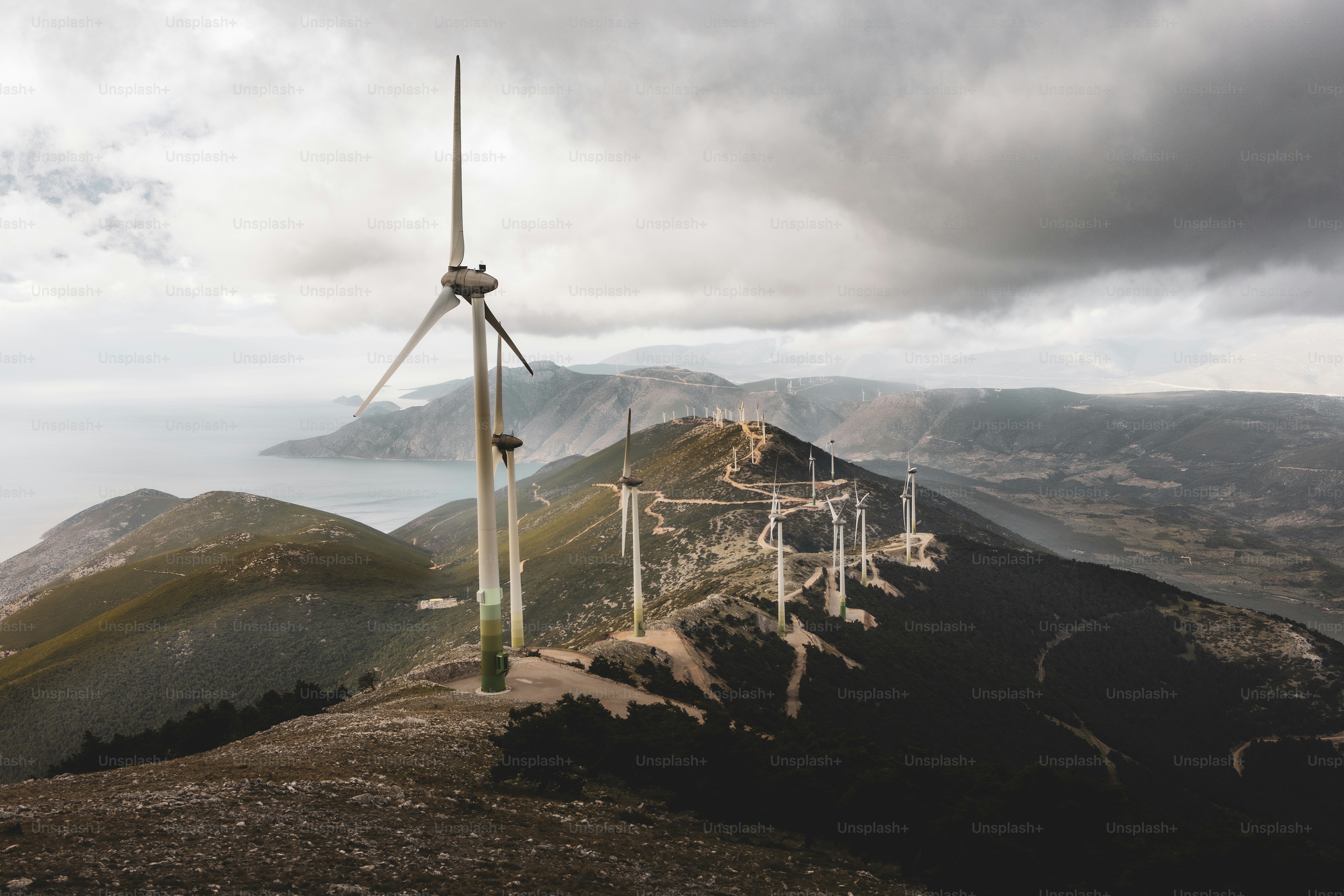 a wind turbine on top of a mountain