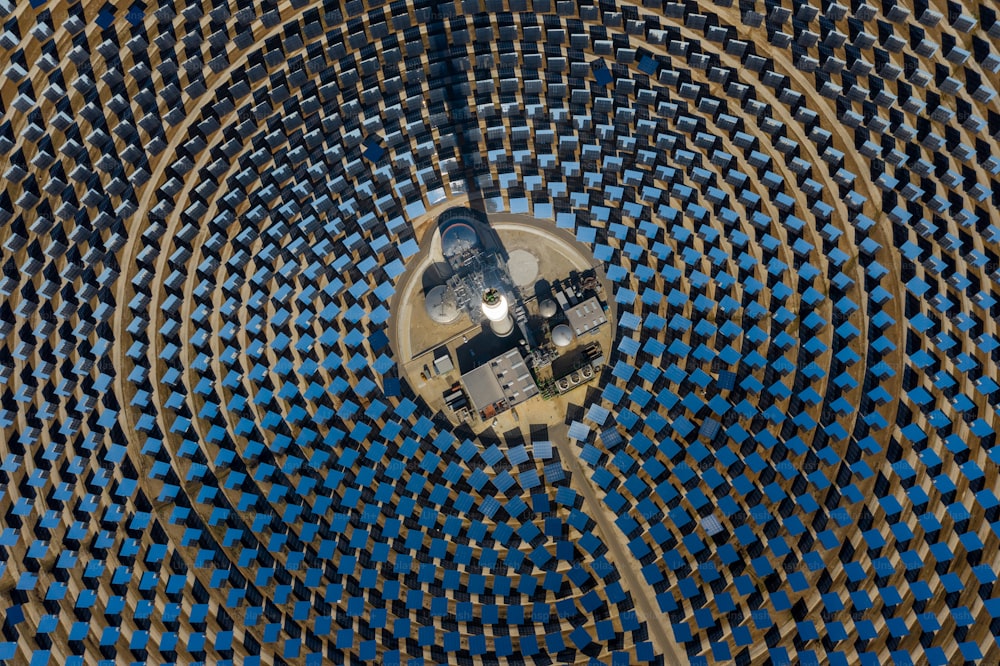 a large metal structure with a clock on top of it