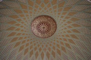 a ceiling with a circular design on it