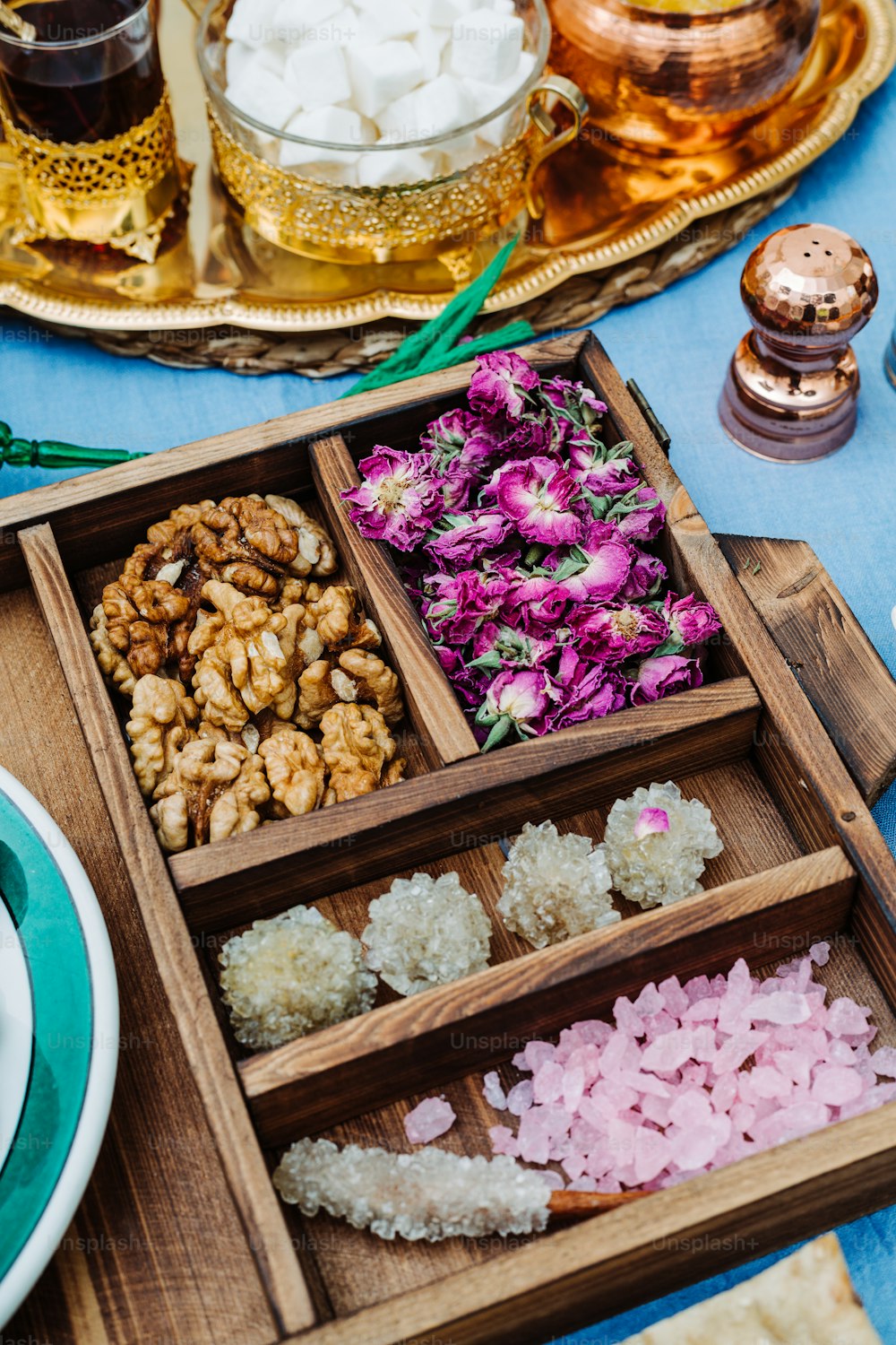 a wooden tray filled with different types of food