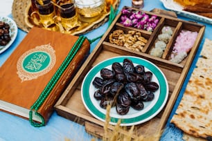 an assortment of food on a table with a book