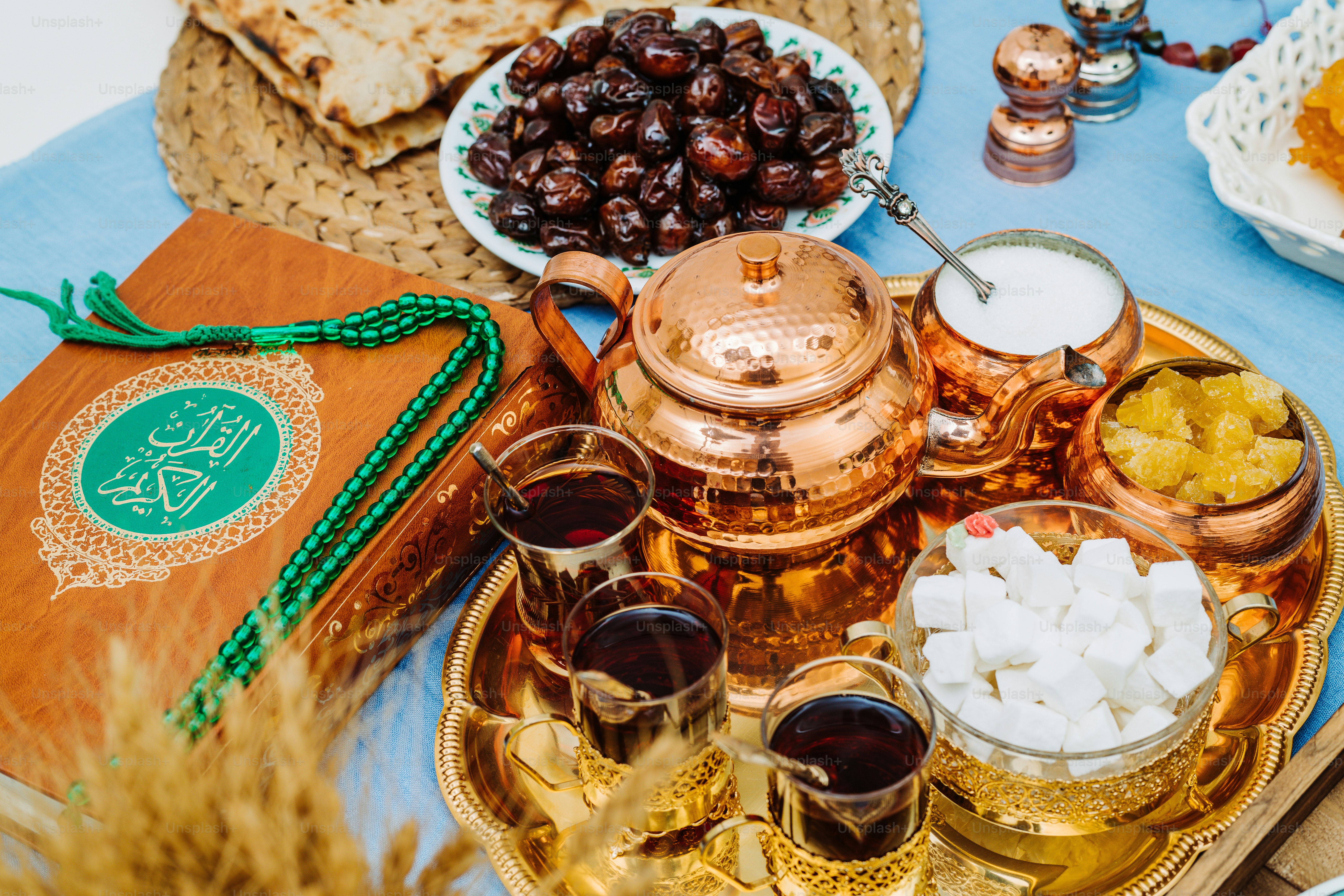 a table topped with plates of food and drinks