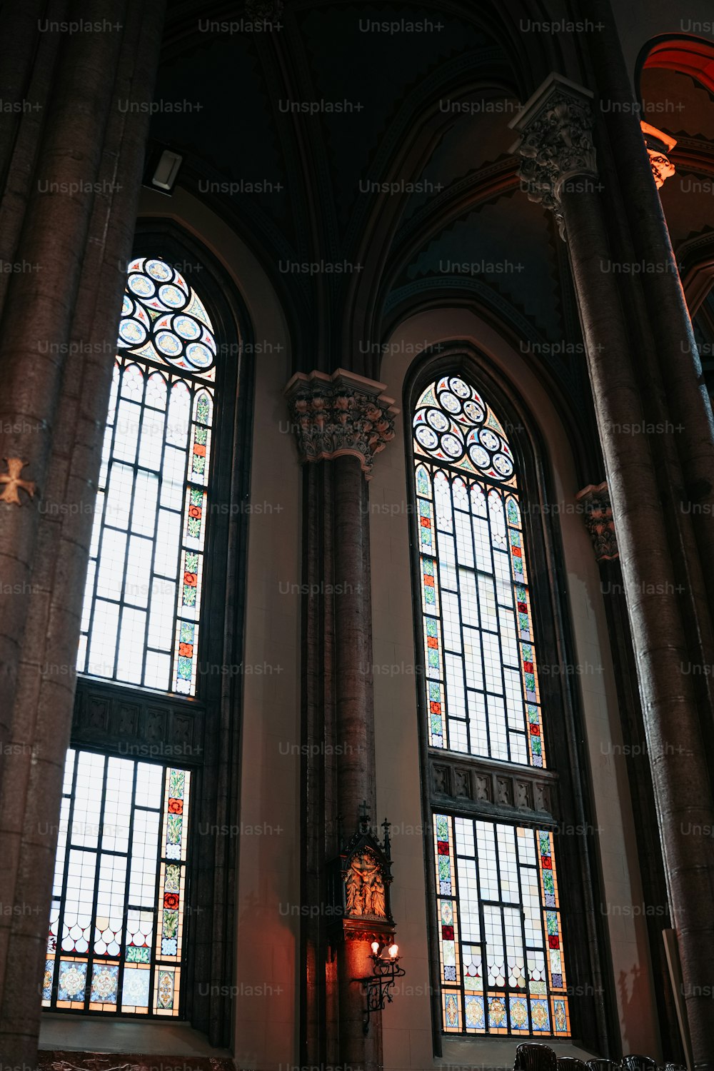 two stained glass windows in a large building