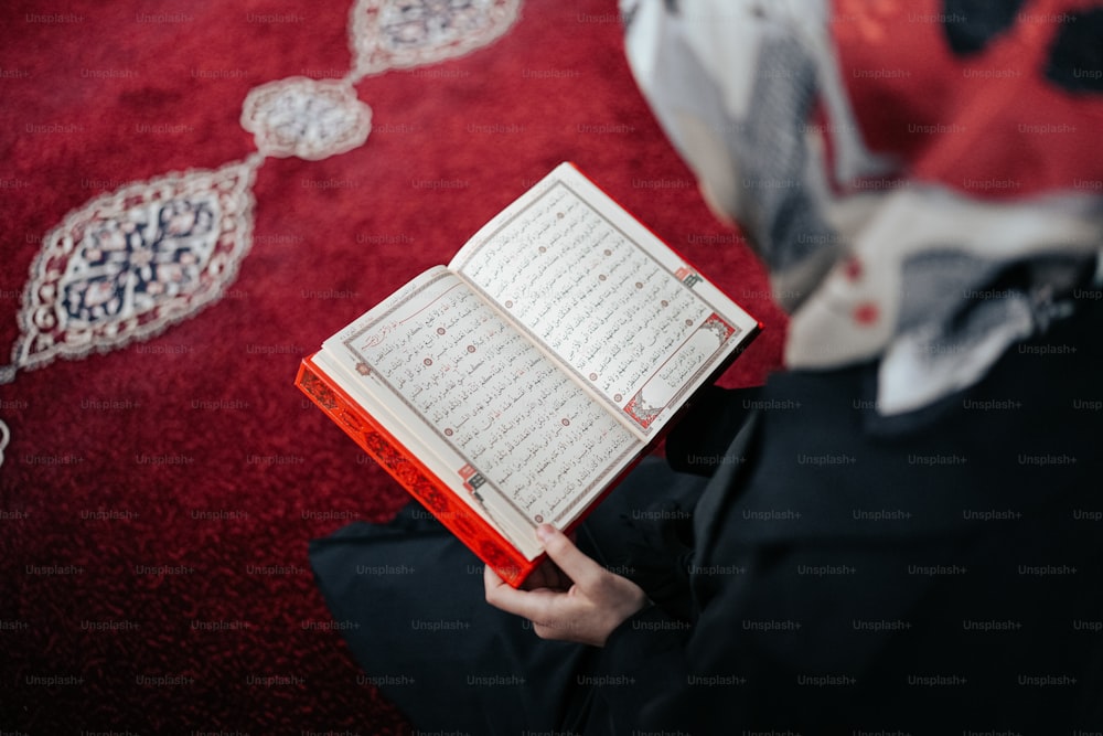 a person holding a book in their hands