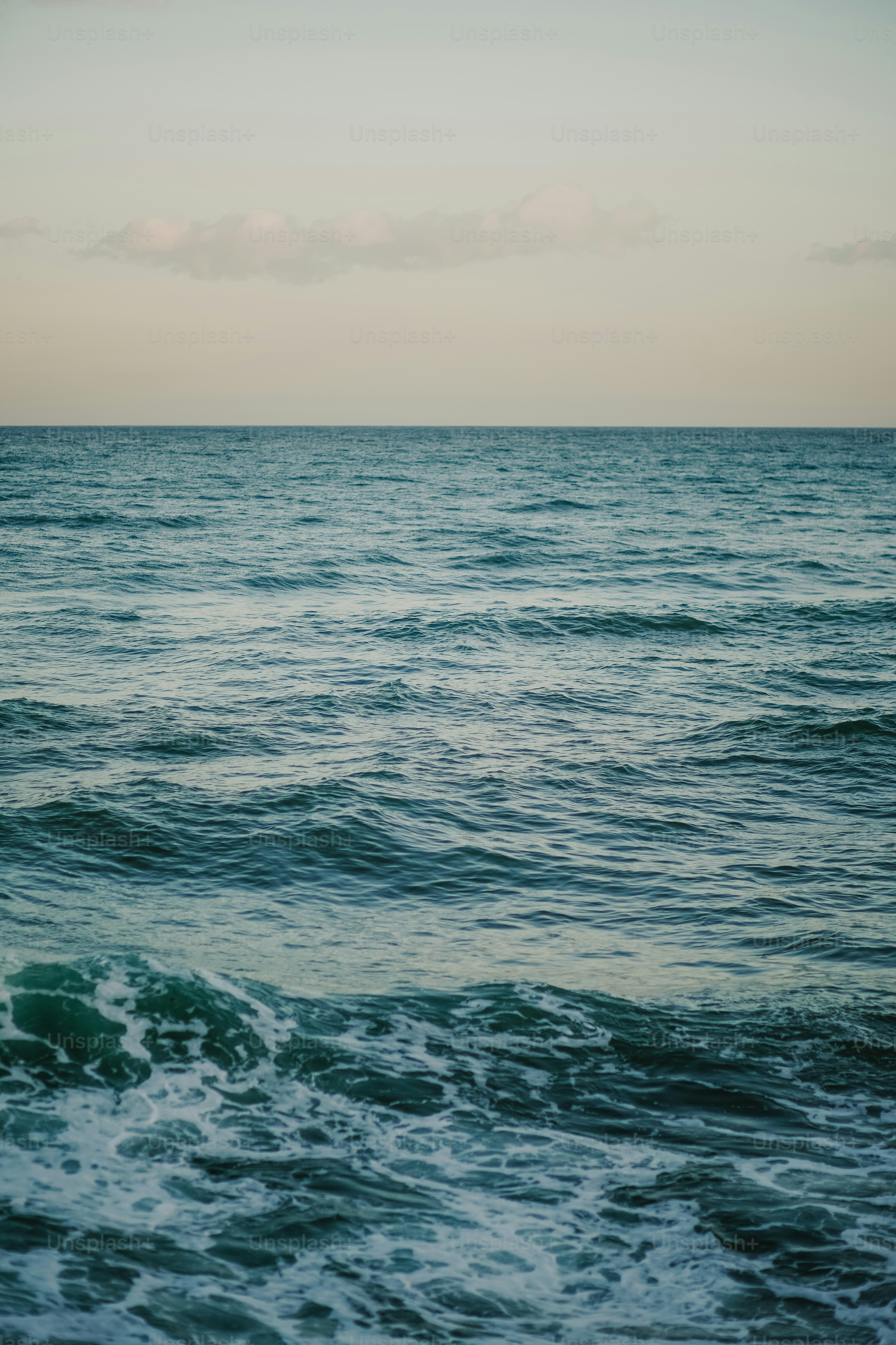 a body of water with waves coming in to shore