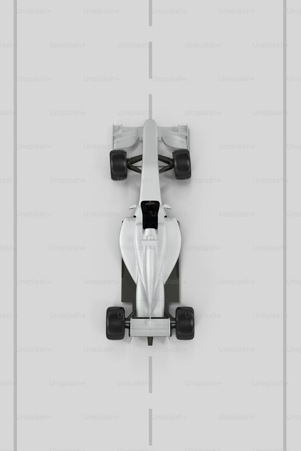 an overhead view of a white race car