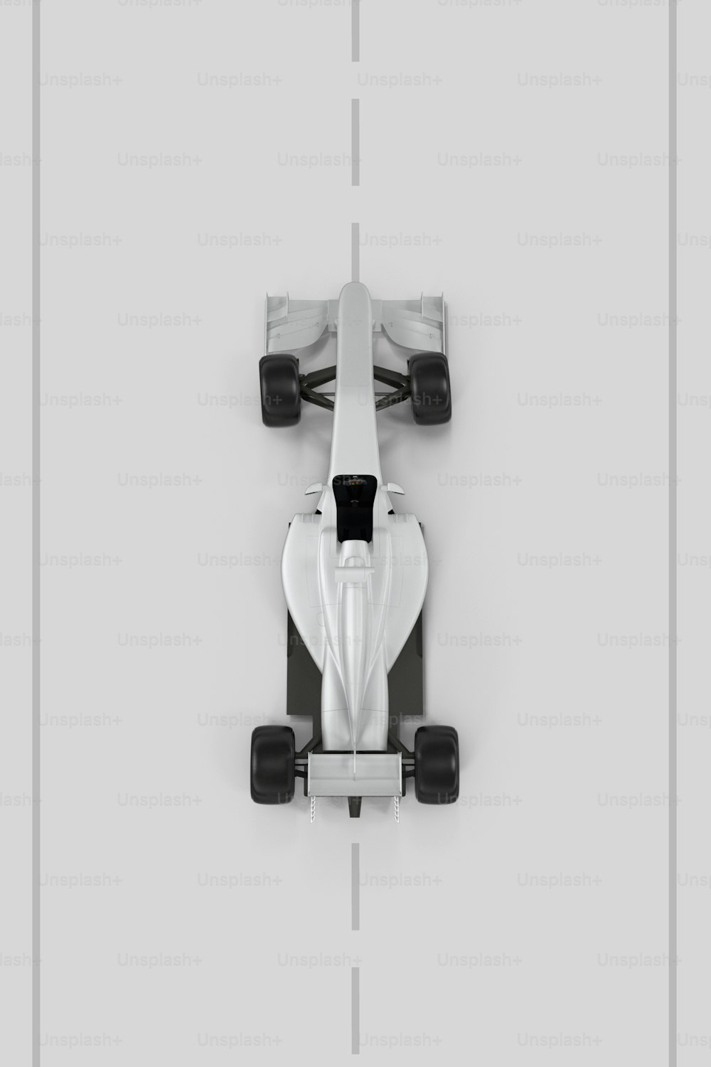 an overhead view of a white race car