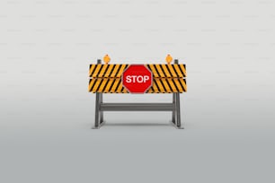 Un segnale di stop rosso seduto in cima a un supporto di metallo