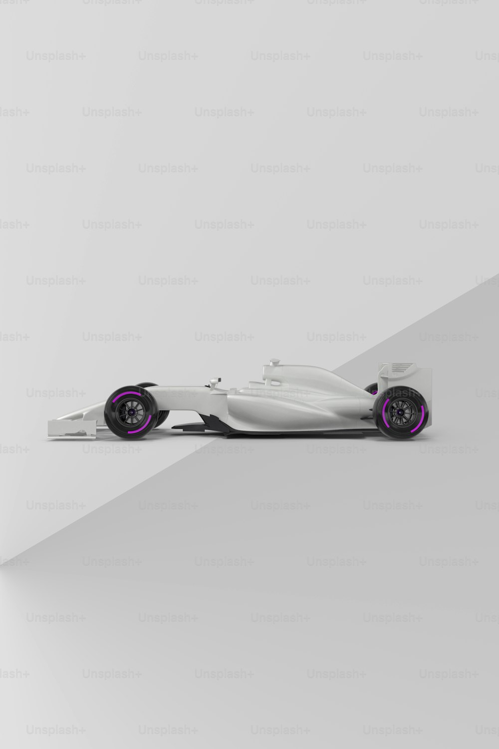 a white race car with purple wheels on a gray background