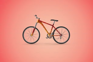 Una bicicleta roja y amarilla sobre fondo rosa