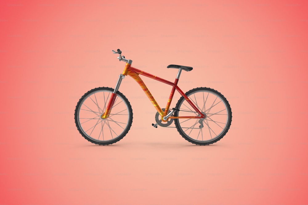 Una bicicleta roja y amarilla sobre fondo rosa